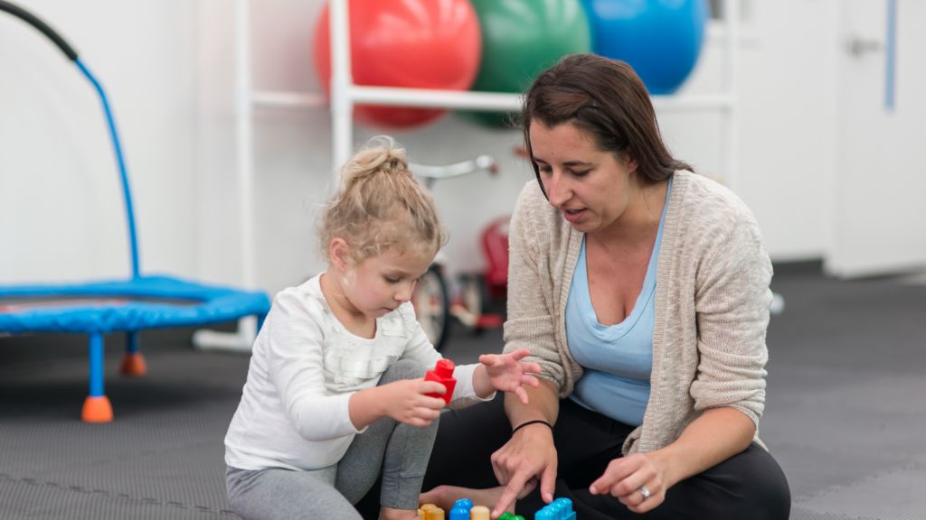 Expert working one-on-one with child